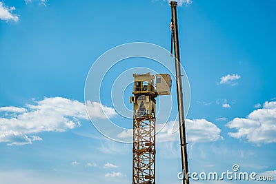 Tower crane assembly. Installation of a construction crane. Editorial Stock Photo