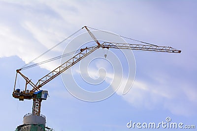 Tower cranes are a modern form of balance crane that used in the construction of tall buildings. Stock Photo