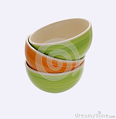 A tower of green and orange ceramic plates, natural bright color Stock Photo