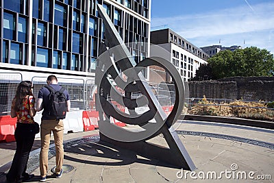 Tower Hill Sundial sculpture underground with tourist Editorial Stock Photo