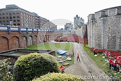 The Tower of London Moat filled with Ceramic Poppies , an art installation named Blood Swept Lands and Seas of Red. Editorial Stock Photo