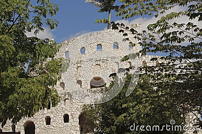 Tower of stone with a palm in Xcaret Editorial Stock Photo