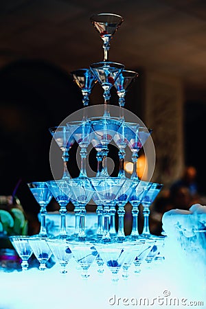 Tower of Martini glasses at a festive event Stock Photo