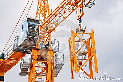 Setting up a tower crane in the construction site in HCMC, Vietnam Editorial Stock Photo