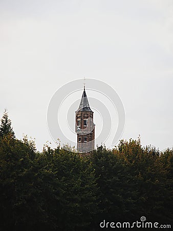 Tower of medieval archers guild Koninklijke Hoofdgilde Sint Sebastiaan schuttersgilde between trees in Bruges Belgium Stock Photo