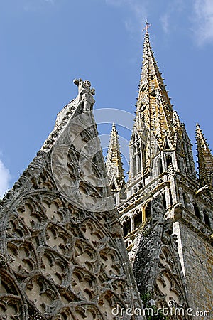 The tower of the roman-gothic, collegiate church of Notre-Dame-de-Roscudon Stock Photo