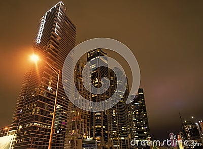 Towerblocks lit up in night city of Miami, USA Stock Photo