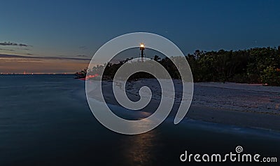 Towering Lighthouse Shining the Way Stock Photo