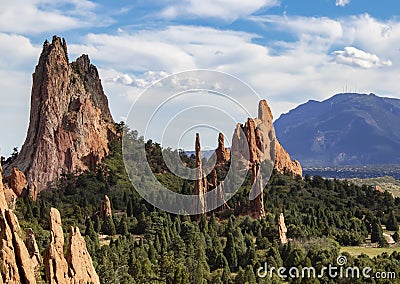 The towering red rock formations of the Garden of the Gods of Colorado Springs with Cheyenne Mountain in the background Stock Photo