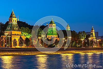 Towers of Moscow Kremlin along Kremlevskaya embankment at night, Russia Stock Photo