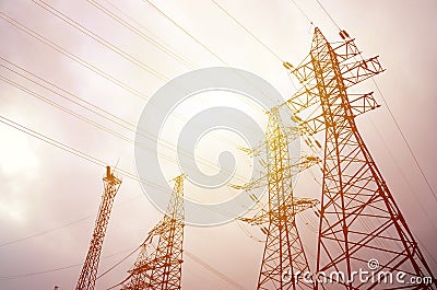 Towers power lines against a cloudy sky background. Electricity Stock Photo