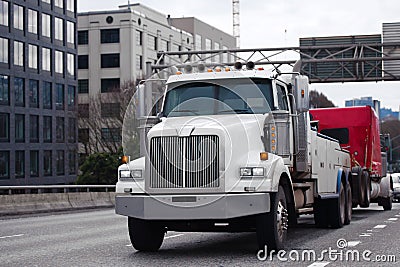 Towing powerful semi truck tow broken big rig semi truck fleet o Stock Photo