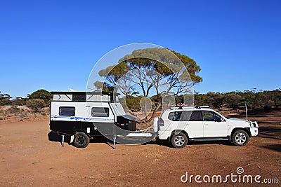 Towing vehicle and a caravan camping in the outback of Western Australia Editorial Stock Photo