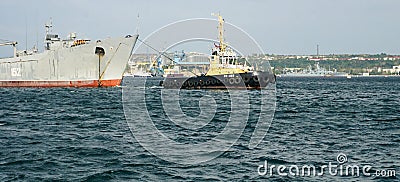 Towing of the vessel in Sevastopol Bay Editorial Stock Photo