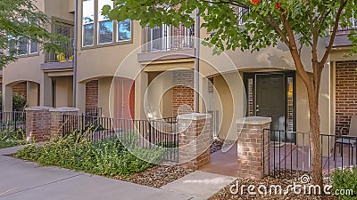 A townhome with fences porches and balconies Stock Photo