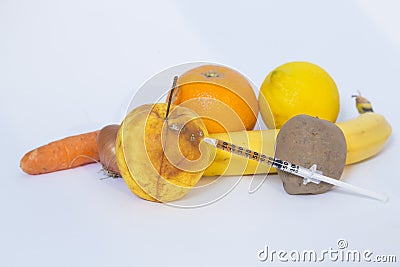 Fruits and legumes injected with chemical Stock Photo