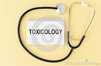 Toxicology on the Document with yellow background. Stock Photo
