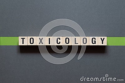Toxicology - word concept on cubes Stock Photo
