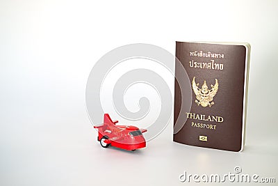 Toy airplane and Thai citizen passport and Thailand official passport Stock Photo