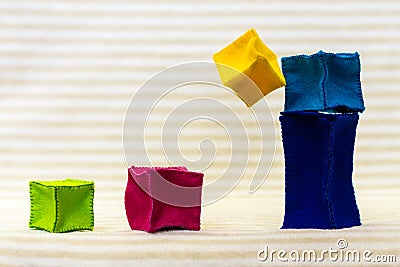 Toy bricks falling down Stock Photo