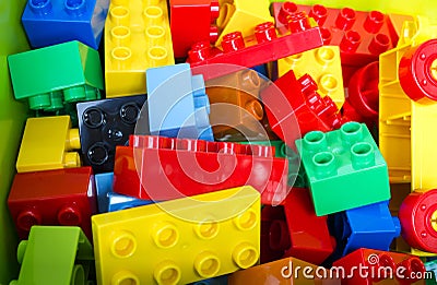 Toy building colorful blocks on green box. Stock Photo