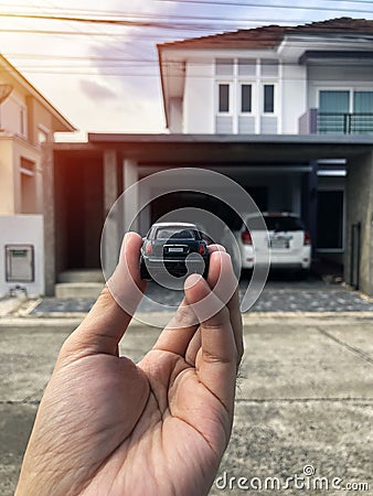 Toy car in hand It`s like parking in a car park. Stock Photo