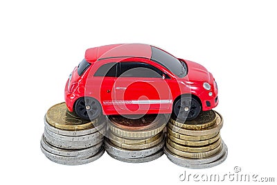 Toy car on top of stacks of coins Stock Photo