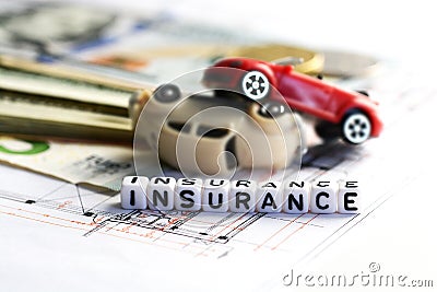 Toy cars accident damage and insurance word from tiled letter blocks Stock Photo