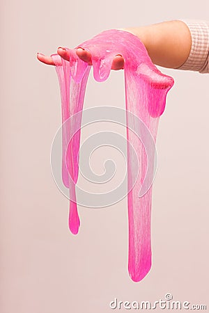 A toy for children mucus and liquid flowing on hand. Stock Photo
