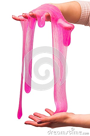 A toy for children mucus and liquid flowing on hand on a white background. Stock Photo