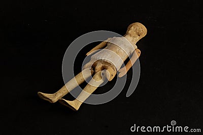 Toy doll from archaeological excavation , Stock Photo