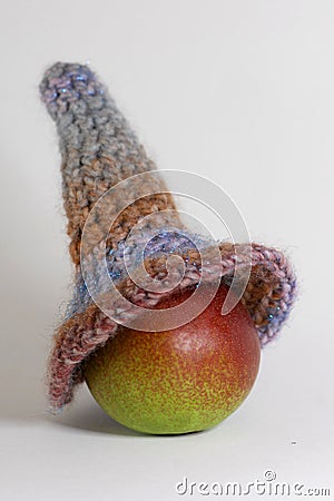 Toy head made of pear and self-made violet cup Stock Photo