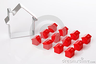 Toy houses and metallic shape of a house Editorial Stock Photo