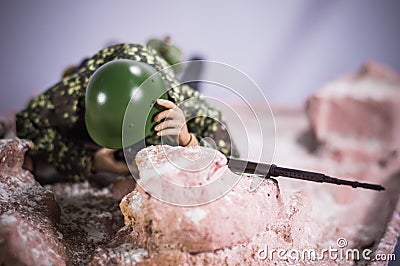 Toy man soldier action figure miniature realistic silk diorama background Stock Photo