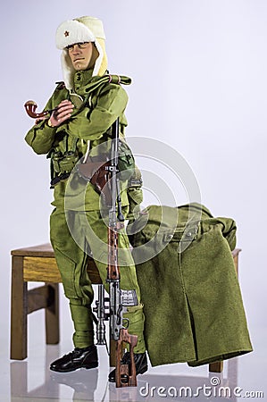 Toy man soldier action figure miniature realistic silk white and isolated background Stock Photo