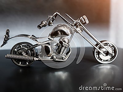 Toy motorcycle made of metal on a dark background Stock Photo