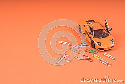 Toy orange car, on orange background. Sports car, close-up shot Stock Photo