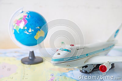 Toy plane on world map Stock Photo