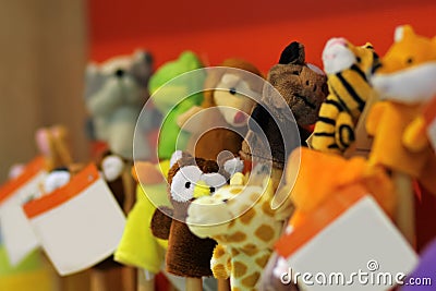 Toy puppets on wooden sticks for preschool nursery theatre, standing in a row. Stock Photo