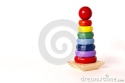 toy pyramid, wooden, multi - colored rings, on a white background Stock Photo