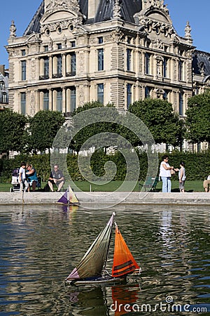 Toy Sailboat in pond, Lourve, Jardin Paris, France Editorial Stock Photo