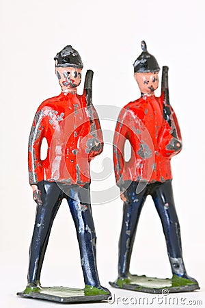 Toy soldiers - Marching guards with rifles Stock Photo