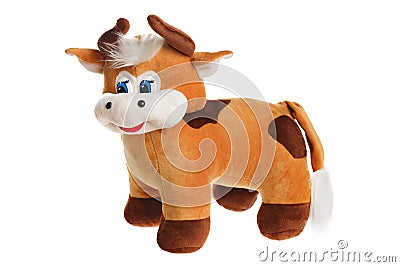 Toy stuffed cow puppet isolated at white background. Symbol of chinese new year. Cuddly toy animal Stock Photo