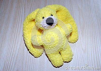 Toy yellow knitted hare. Manual work. Hobby - knitting. Stock Photo