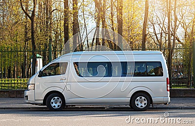 Toyota Hiace mini truck parked on street near city park. Editorial Stock Photo