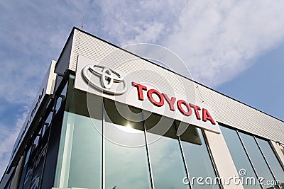 Toyota motor corporation logo on dealership building Editorial Stock Photo