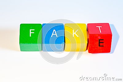 Toys building blocks with the german word FAKT that stands for fact in which the last letter was changed to an E and this creates Stock Photo