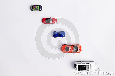 Toys constuctor and cars, top view on white background, place for text Stock Photo