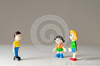 Toys figurines man and woman talking from a distance for fear of coronavirus contamination. Prevention of disease transmission Stock Photo