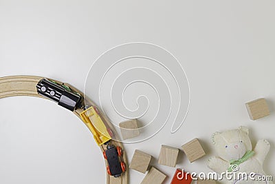 Toys frame with teddy, wooden cubes and toy train on the white background Stock Photo